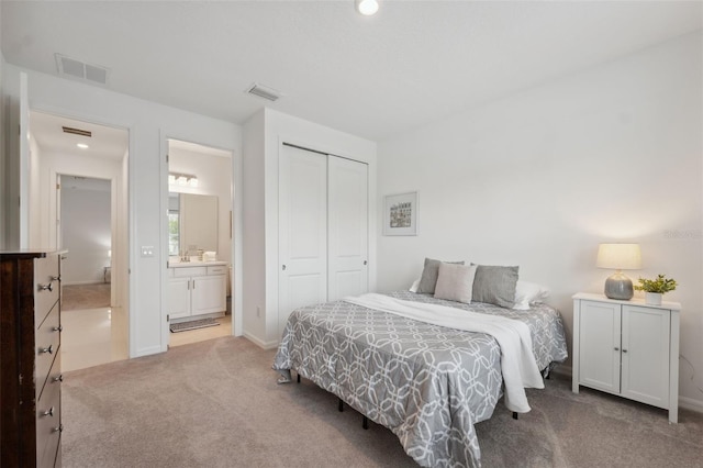 33466 Landsman Loop, Wesley Chapel, FL 33543 - carpeted bedroom featuring a closet, ensuite bath, and recessed lighting