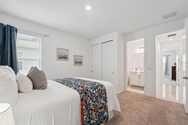 33466 Landsman Loop, Wesley Chapel, FL 33543 - carpeted bedroom featuring a closet, recessed lighting, and ensuite bathroom