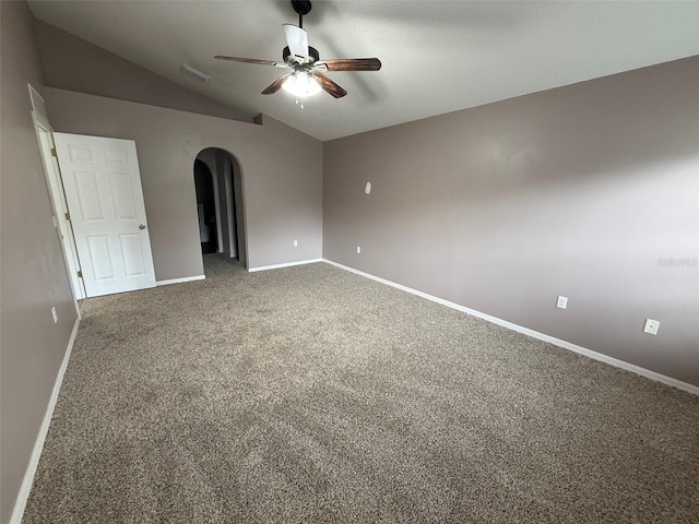 11308 Mahopac Rd, Weeki Wachee, FL 34614 - carpeted spare room featuring a ceiling fan, arched walkways, and vaulted ceiling