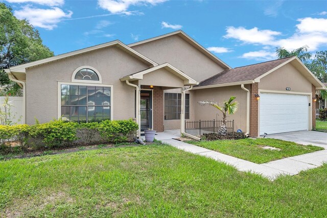 2048 Ground Squirrel Dr, New Port Richey, FL 34655 - view of front facade with stucco siding, a garage, and concrete driveway