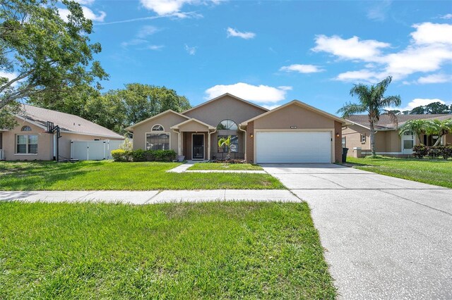 2048 Ground Squirrel Dr, New Port Richey, FL 34655 - single story home featuring a garage, driveway, and stucco siding