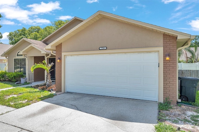 2048 Ground Squirrel Dr, New Port Richey, FL 34655 - single story home with stucco siding, concrete driveway, brick siding, and a garage