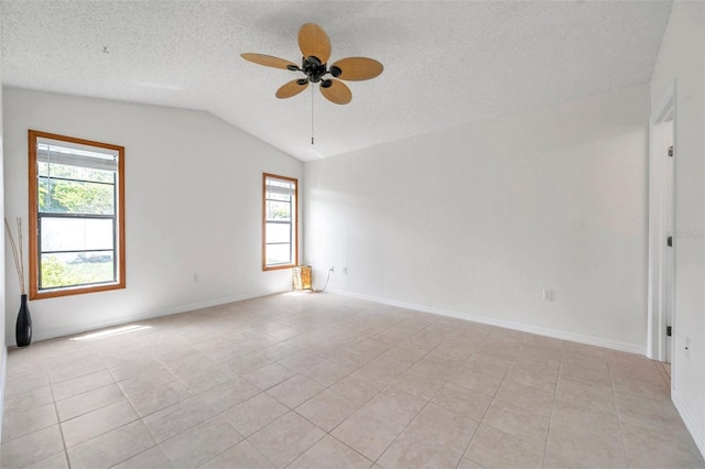 2048 Ground Squirrel Dr, New Port Richey, FL 34655 - spare room featuring lofted ceiling, ceiling fan, a textured ceiling, and light tile patterned flooring