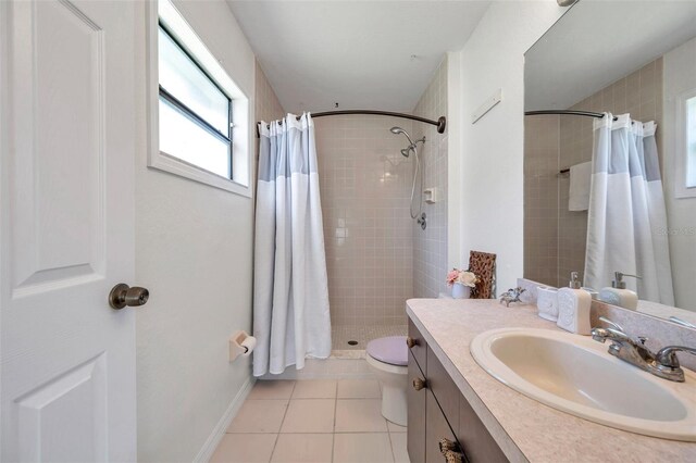 2048 Ground Squirrel Dr, New Port Richey, FL 34655 - bathroom with vanity, tile patterned flooring, and a tile shower