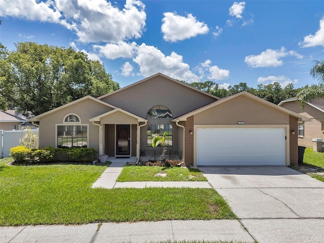 2048 Ground Squirrel Dr, New Port Richey, FL 34655 - ranch-style home with an attached garage, driveway, stucco siding, and brick siding