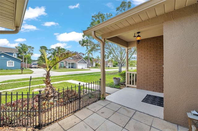 2048 Ground Squirrel Dr, New Port Richey, FL 34655 - covered porch featuring a residential view
