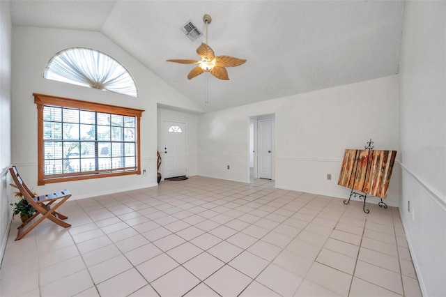 2048 Ground Squirrel Dr, New Port Richey, FL 34655 - unfurnished living room with a ceiling fan, light tile patterned floors, and high vaulted ceiling