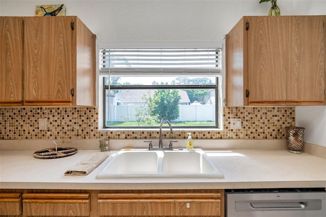 2048 Ground Squirrel Dr, New Port Richey, FL 34655 - kitchen featuring dishwasher, light countertops, and backsplash