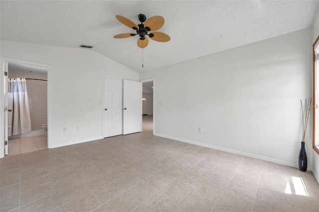 2048 Ground Squirrel Dr, New Port Richey, FL 34655 - spare room with a ceiling fan, vaulted ceiling, and light tile patterned floors