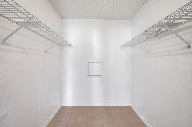 2048 Ground Squirrel Dr, New Port Richey, FL 34655 - walk in closet featuring tile patterned flooring