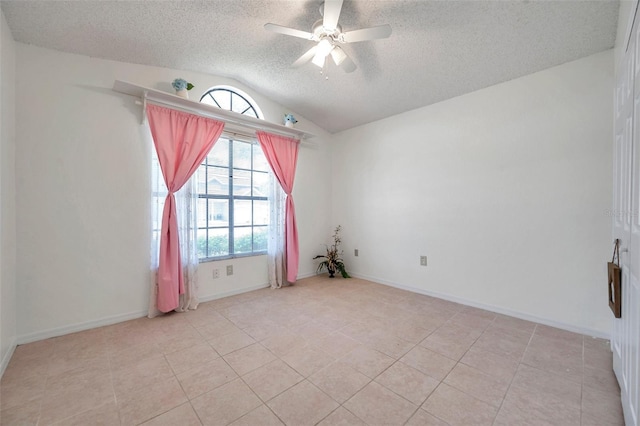 2048 Ground Squirrel Dr, New Port Richey, FL 34655 - spare room featuring a textured ceiling, lofted ceiling, ceiling fan, and light tile patterned floors