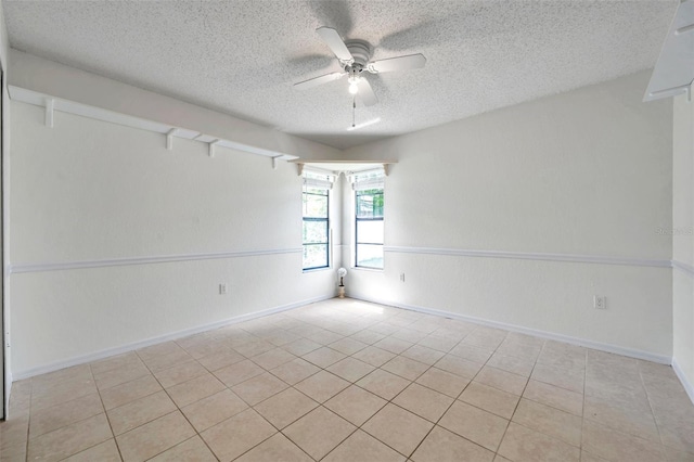 2048 Ground Squirrel Dr, New Port Richey, FL 34655 - spare room with a textured ceiling, a ceiling fan, and tile patterned flooring