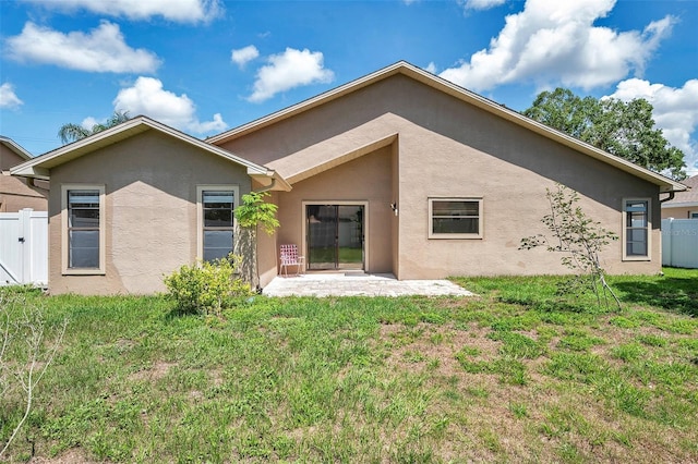 2048 Ground Squirrel Dr, New Port Richey, FL 34655 - back of property featuring stucco siding and a patio