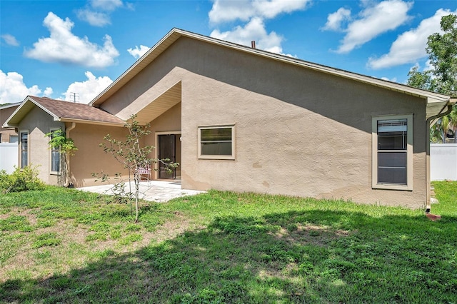 2048 Ground Squirrel Dr, New Port Richey, FL 34655 - rear view of house with stucco siding and a patio