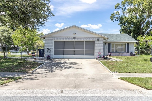 7701 Anaheim Ave, New Port Richey, FL 34655 - ranch-style home with brick siding, concrete driveway, and a garage