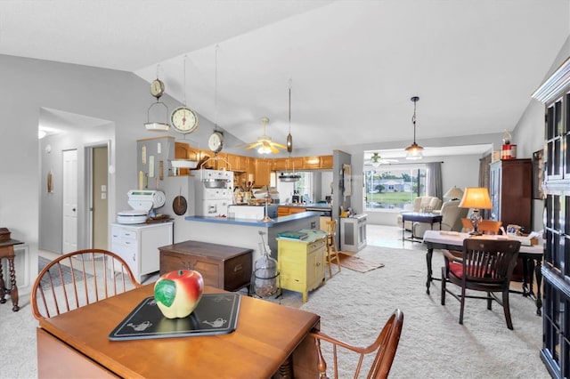 7701 Anaheim Ave, New Port Richey, FL 34655 - dining space featuring light colored carpet, ceiling fan, and lofted ceiling
