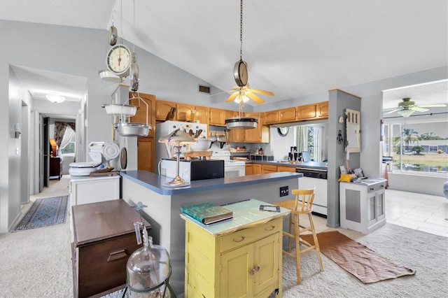7701 Anaheim Ave, New Port Richey, FL 34655 - kitchen with a ceiling fan, white appliances, vaulted ceiling, light carpet, and light tile patterned floors
