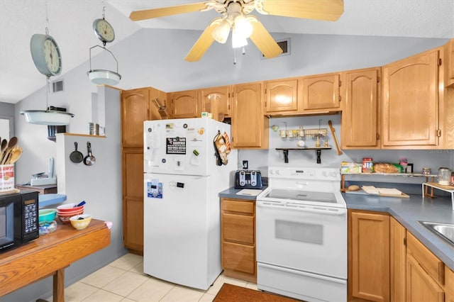 7701 Anaheim Ave, New Port Richey, FL 34655 - kitchen with white appliances, vaulted ceiling, light tile patterned floors, ceiling fan, and dark countertops