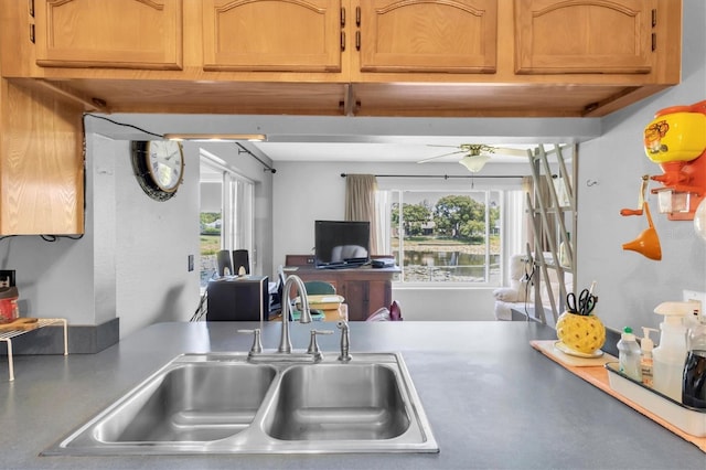 7701 Anaheim Ave, New Port Richey, FL 34655 - kitchen featuring light countertops and brown cabinetry