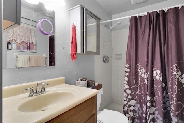 7701 Anaheim Ave, New Port Richey, FL 34655 - full bath featuring vanity, tiled shower, and a textured wall