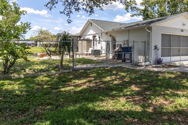 7701 Anaheim Ave, New Port Richey, FL 34655 - view of side of property with a gate and an attached garage