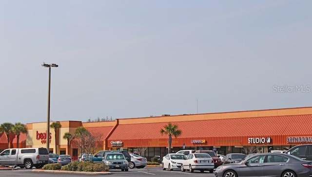 7701 Anaheim Ave, New Port Richey, FL 34655 - view of commercial property featuring uncovered parking