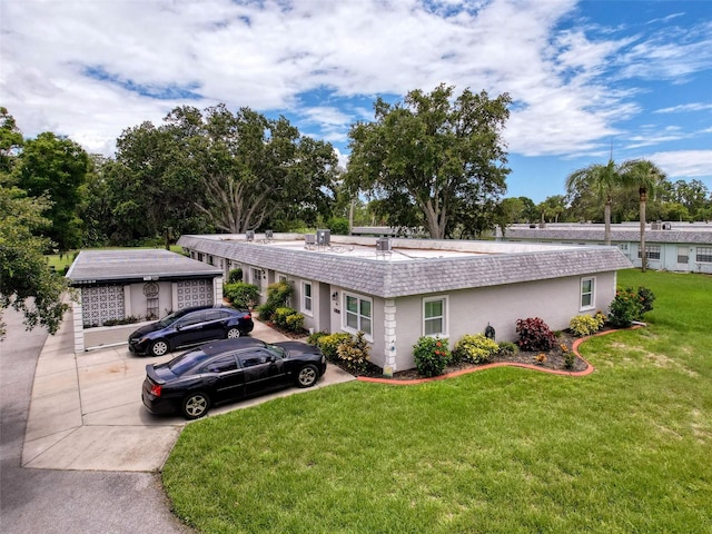 3712 Trophy Blvd Unit 3712, New Port Richey, FL 34655 - ranch-style house with a front lawn and stucco siding