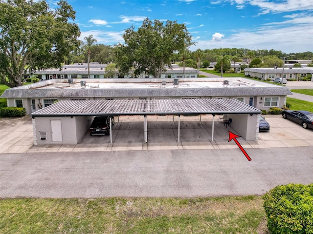 3712 Trophy Blvd Unit 3712, New Port Richey, FL 34655 - view of building exterior with covered and uncovered parking