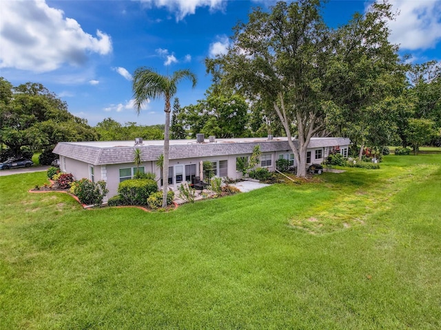 3712 Trophy Blvd Unit 3712, New Port Richey, FL 34655 - view of front facade featuring a front lawn and view of scattered trees