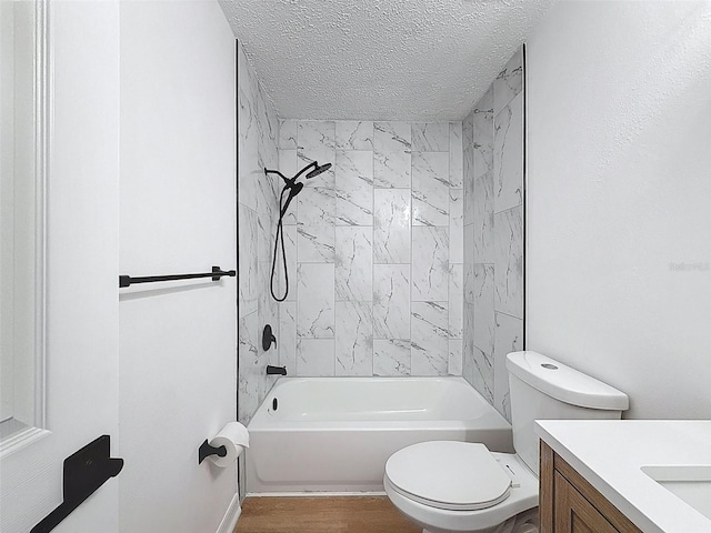 3712 Trophy Blvd Unit 3712, New Port Richey, FL 34655 - bathroom with vanity, shower / bath combination, a textured ceiling, and wood finished floors