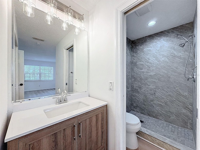 3712 Trophy Blvd Unit 3712, New Port Richey, FL 34655 - full bathroom with a stall shower, vanity, and a textured ceiling