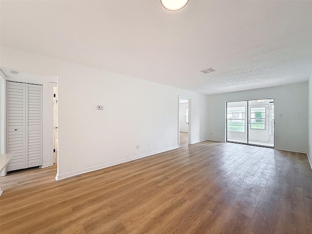 3712 Trophy Blvd Unit 3712, New Port Richey, FL 34655 - spare room featuring light wood-style flooring and baseboards