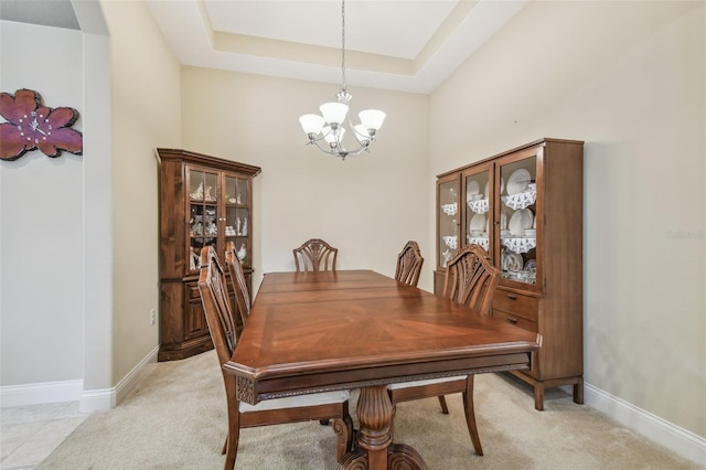 20820 Amanda Oak Ct, Land O Lakes, FL 34638 - dining room with a chandelier, a tray ceiling, and light carpet