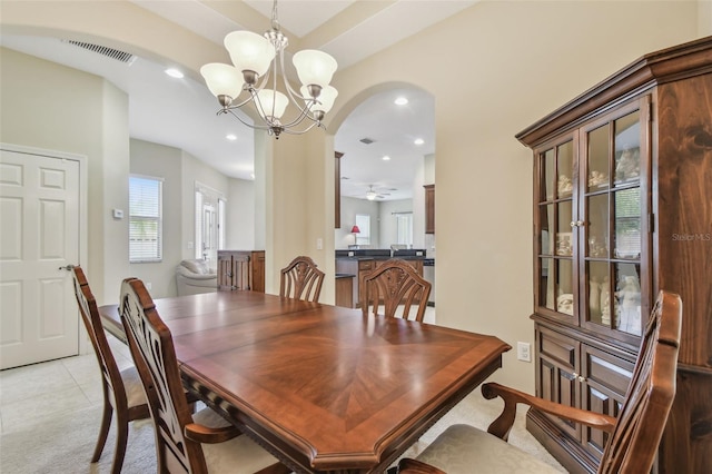 20820 Amanda Oak Ct, Land O Lakes, FL 34638 - dining area with arched walkways, recessed lighting, a chandelier, and light colored carpet