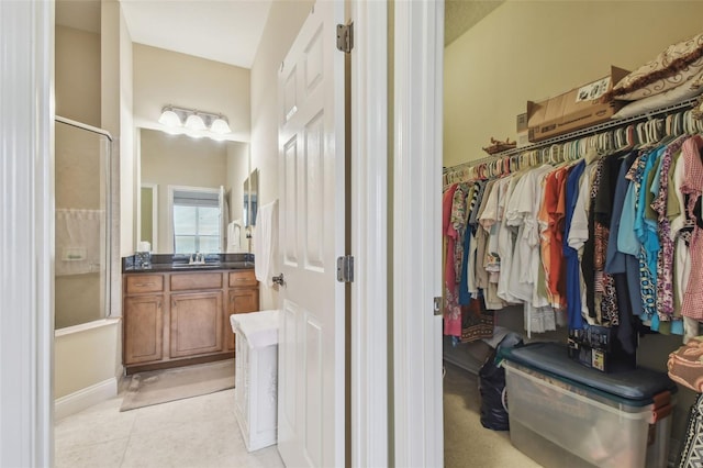 20820 Amanda Oak Ct, Land O Lakes, FL 34638 - spacious closet featuring a sink and light tile patterned floors