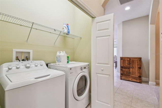 20820 Amanda Oak Ct, Land O Lakes, FL 34638 - washroom featuring separate washer and dryer and light tile patterned floors