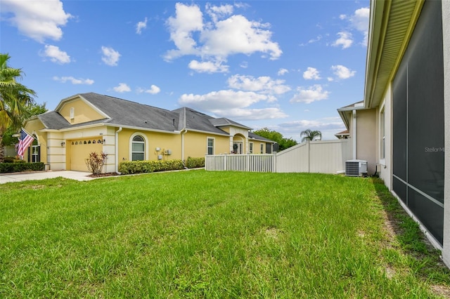 20820 Amanda Oak Ct, Land O Lakes, FL 34638 - view of side of home featuring stucco siding, a garage, and concrete driveway