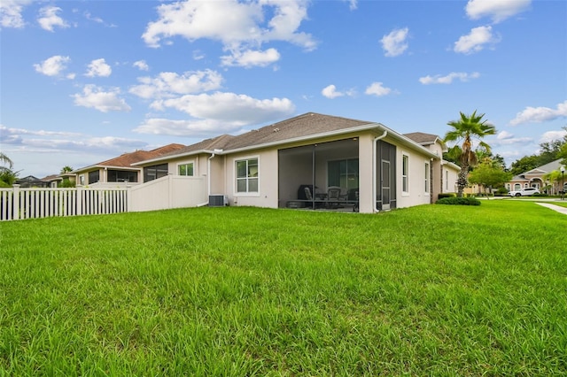 20820 Amanda Oak Ct, Land O Lakes, FL 34638 - back of house with stucco siding and a sunroom