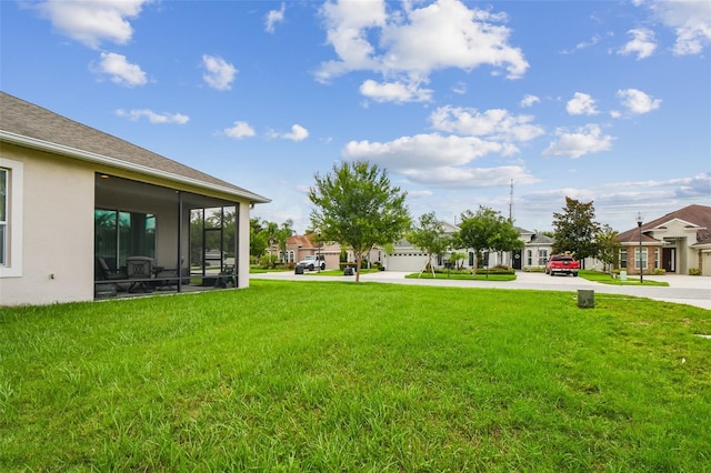 20820 Amanda Oak Ct, Land O Lakes, FL 34638 - view of green lawn with a residential view and a sunroom