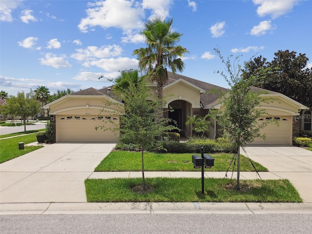 20820 Amanda Oak Ct, Land O Lakes, FL 34638 - view of front facade with driveway, a garage, and stucco siding