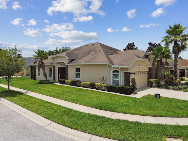 20820 Amanda Oak Ct, Land O Lakes, FL 34638 - ranch-style home featuring stucco siding, concrete driveway, an attached garage, and a front lawn
