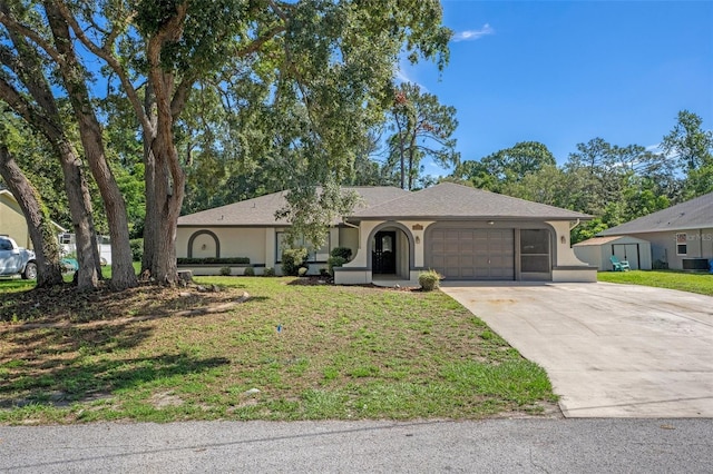 2152 Danforth Rd, Spring Hill, FL 34608 - single story home with stucco siding, a garage, driveway, and a front yard
