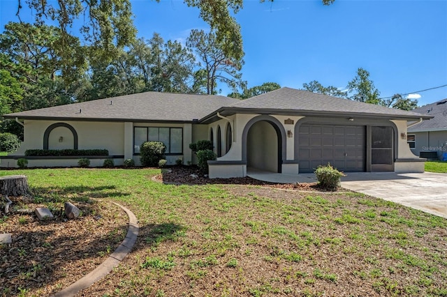 2152 Danforth Rd, Spring Hill, FL 34608 - ranch-style house with an attached garage, concrete driveway, a front lawn, and stucco siding