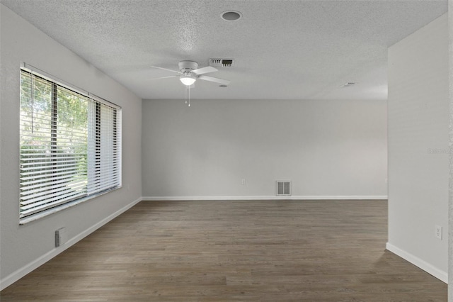 2152 Danforth Rd, Spring Hill, FL 34608 - empty room featuring ceiling fan, wood finished floors, and a textured ceiling