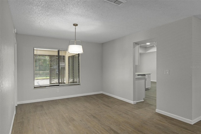 2152 Danforth Rd, Spring Hill, FL 34608 - empty room featuring wood finished floors and a textured ceiling
