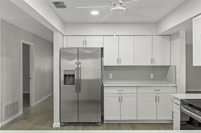 2152 Danforth Rd, Spring Hill, FL 34608 - kitchen with stainless steel appliances, light countertops, and white cabinetry
