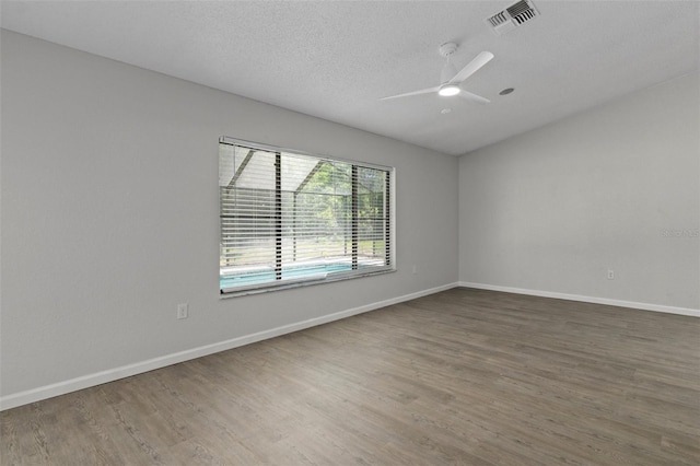 2152 Danforth Rd, Spring Hill, FL 34608 - spare room with wood finished floors, a textured ceiling, and ceiling fan