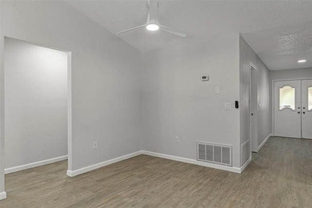 2152 Danforth Rd, Spring Hill, FL 34608 - foyer entrance featuring ceiling fan, wood finished floors, and a textured ceiling