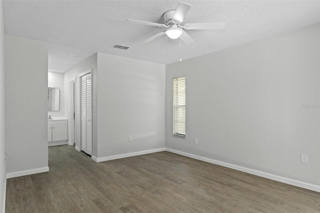 2152 Danforth Rd, Spring Hill, FL 34608 - unfurnished room featuring a ceiling fan, wood finished floors, and a textured ceiling