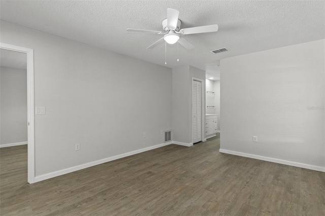 2152 Danforth Rd, Spring Hill, FL 34608 - unfurnished room featuring wood finished floors, a ceiling fan, and a textured ceiling